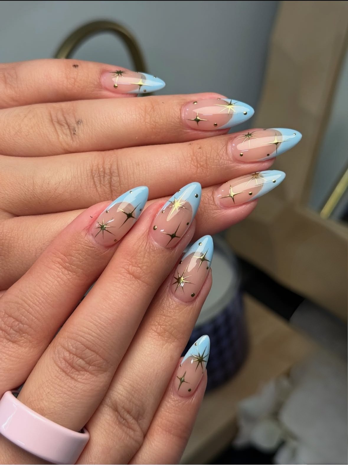 Handmade Nailuxe press-on sets on a pair of hands